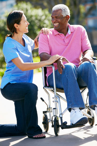 Female caregiver with male senior patient